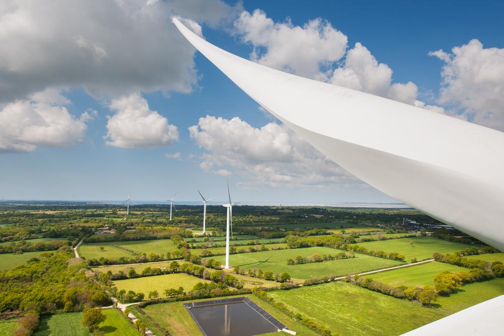 Aerial view of wind turbines in rural landscape
